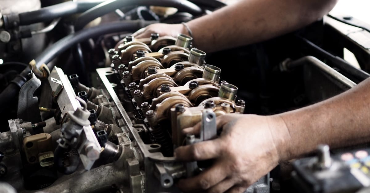 Mechanic working on an engine repair with car repair payment plan options available, making car repair monthly payments and pay later car repairs simple through car service finance.