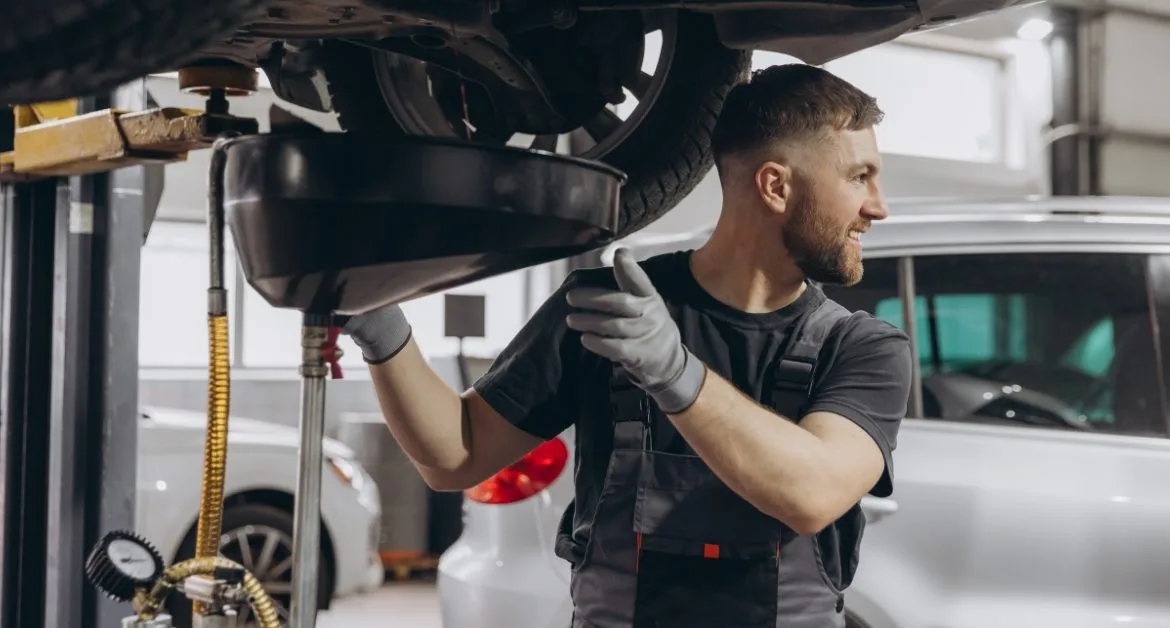 Mechanic carrying out car servicing with finance options, helping customers manage costs with a car repair payment plan, car repair monthly payments, and pay later car repairs.