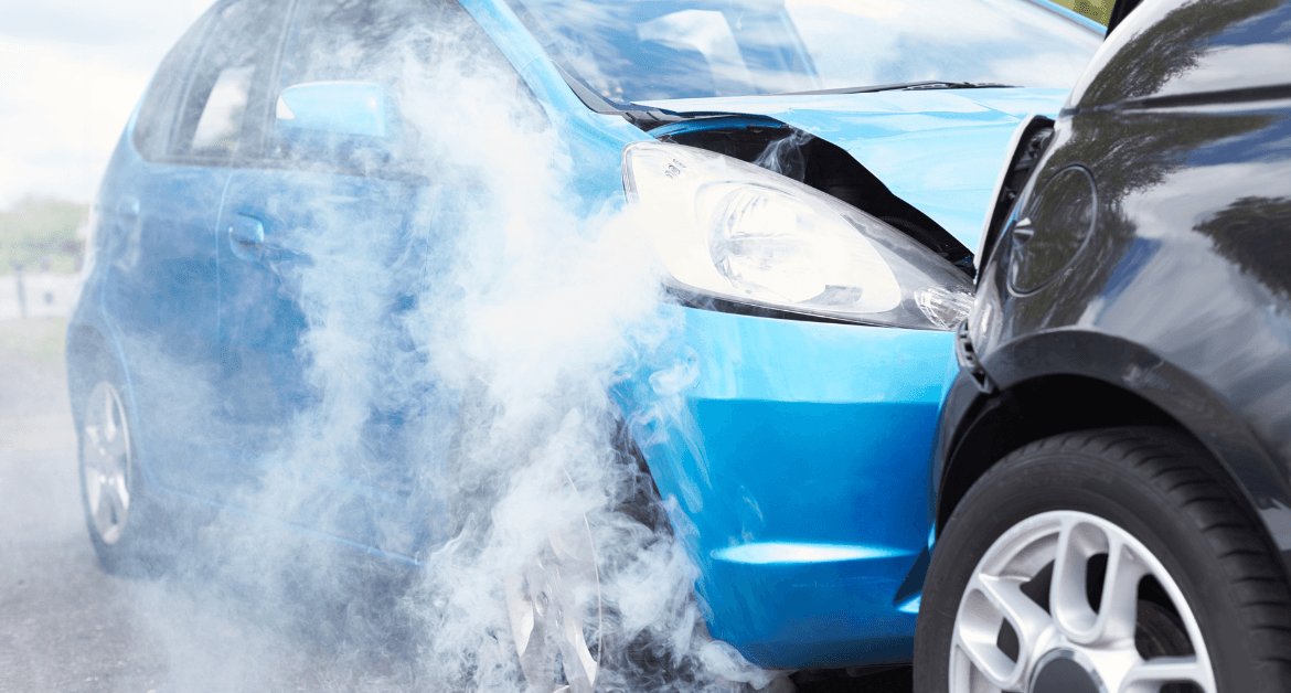Car write-offs: Two cars involved in a collision, showing front-end damage and smoke rising from one vehicle.